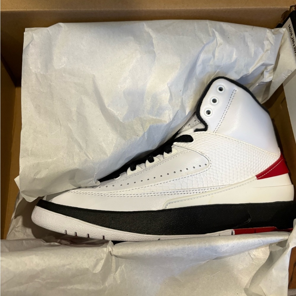 White and Black High-Top Jordan 2s